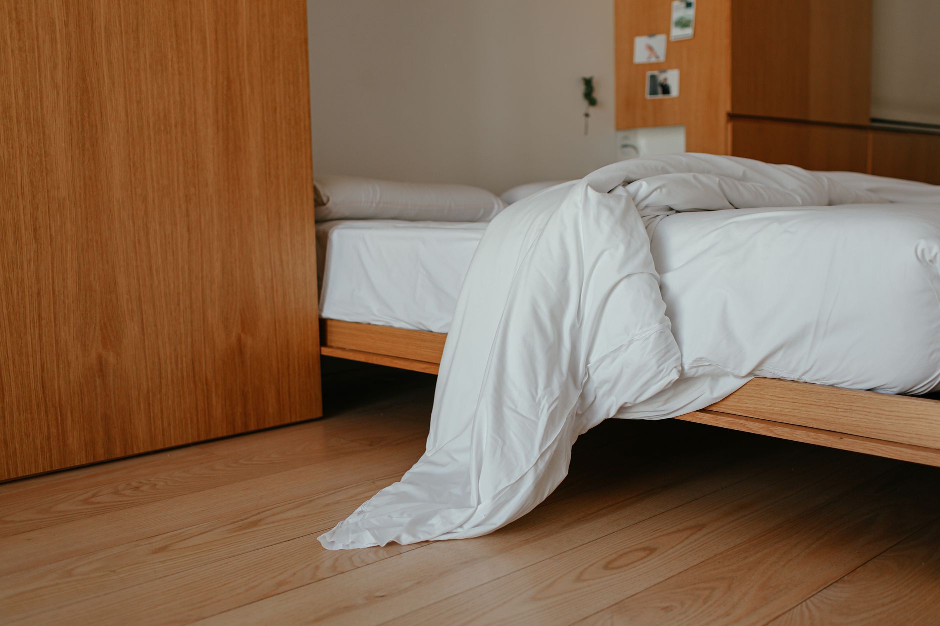 a natural latex and organic cotton mattress on a wooden bed frame