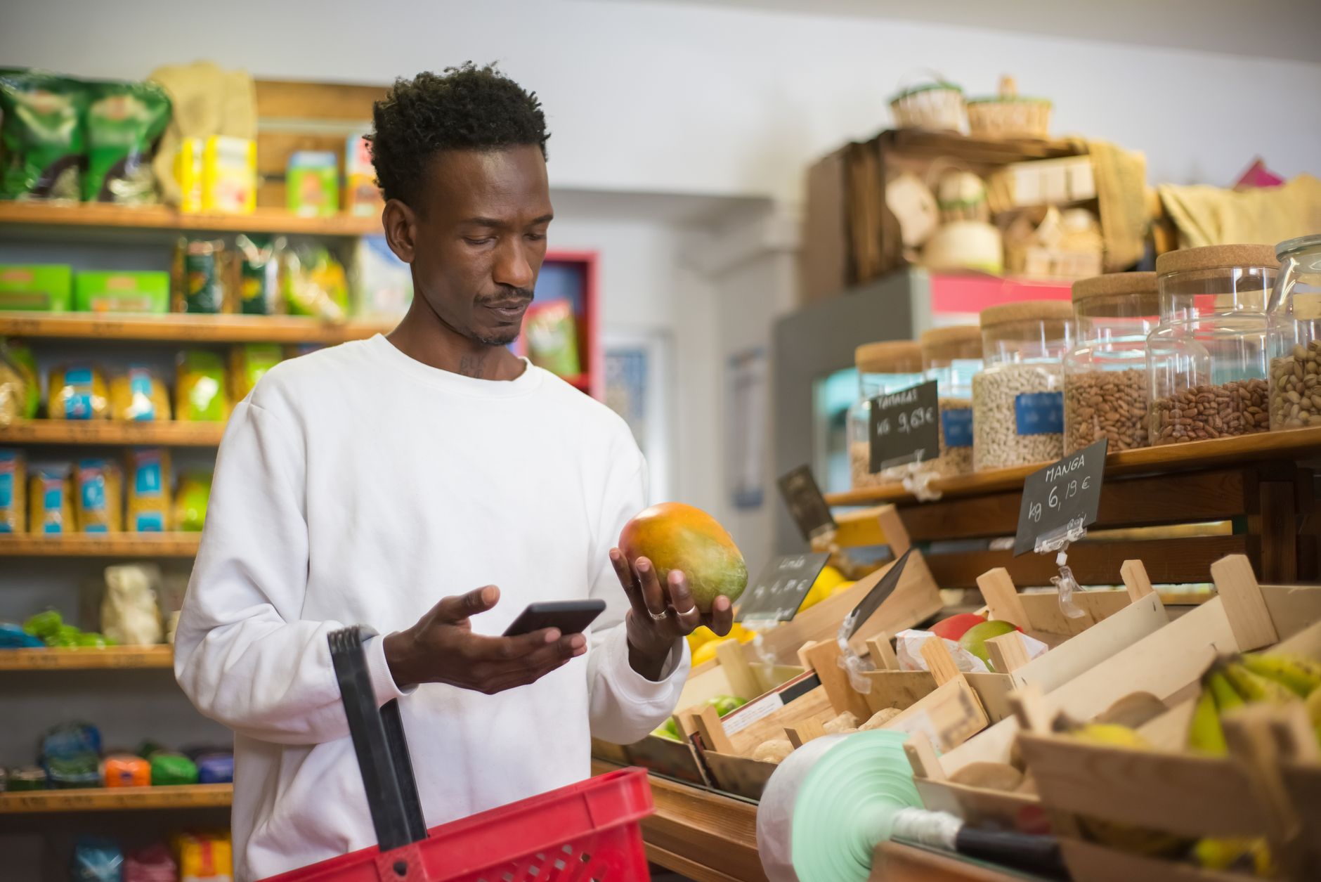 a person using a smartphone to scan a personal care product barcode in a store aisle