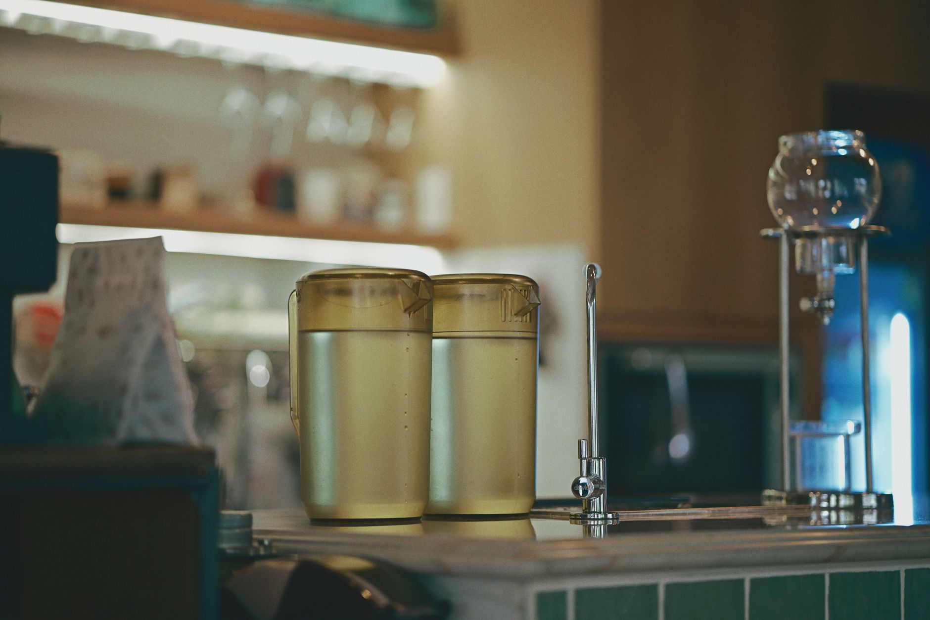 water filter pitcher filled with water on a kitchen counter
