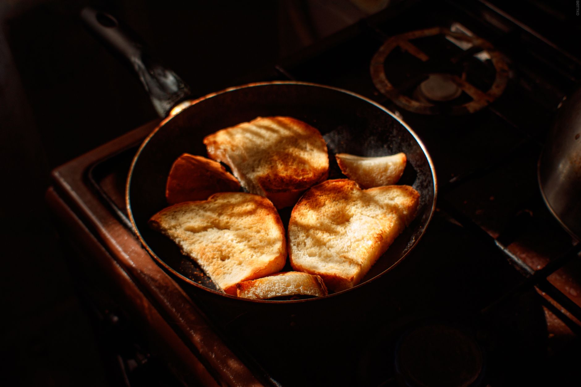 a close-up of a scratched nonstick frying pan surface